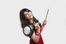 Girl posing with pan and wodden spoon