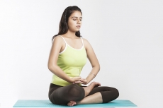 girl sitting in yoga pose