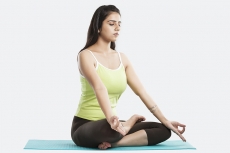 girl sitting in yoga pose